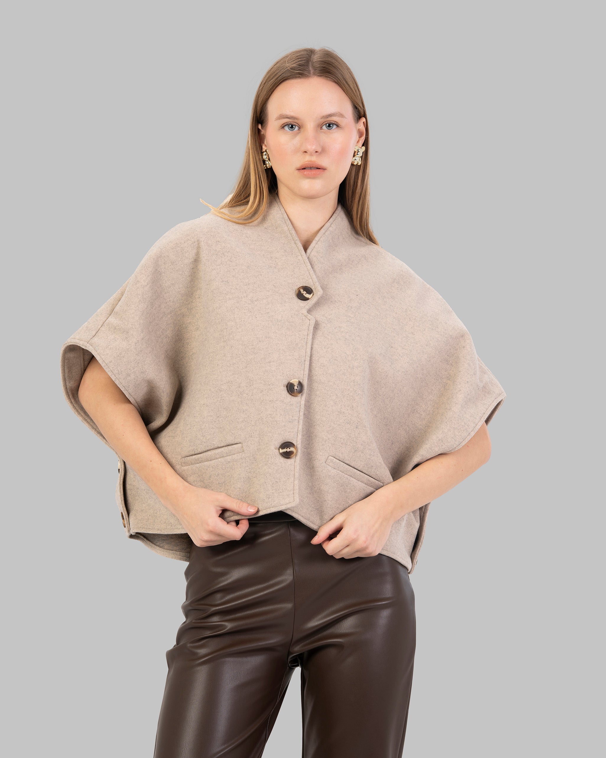 "Short Wool-Blend Cape Jacket With Patch pocket."