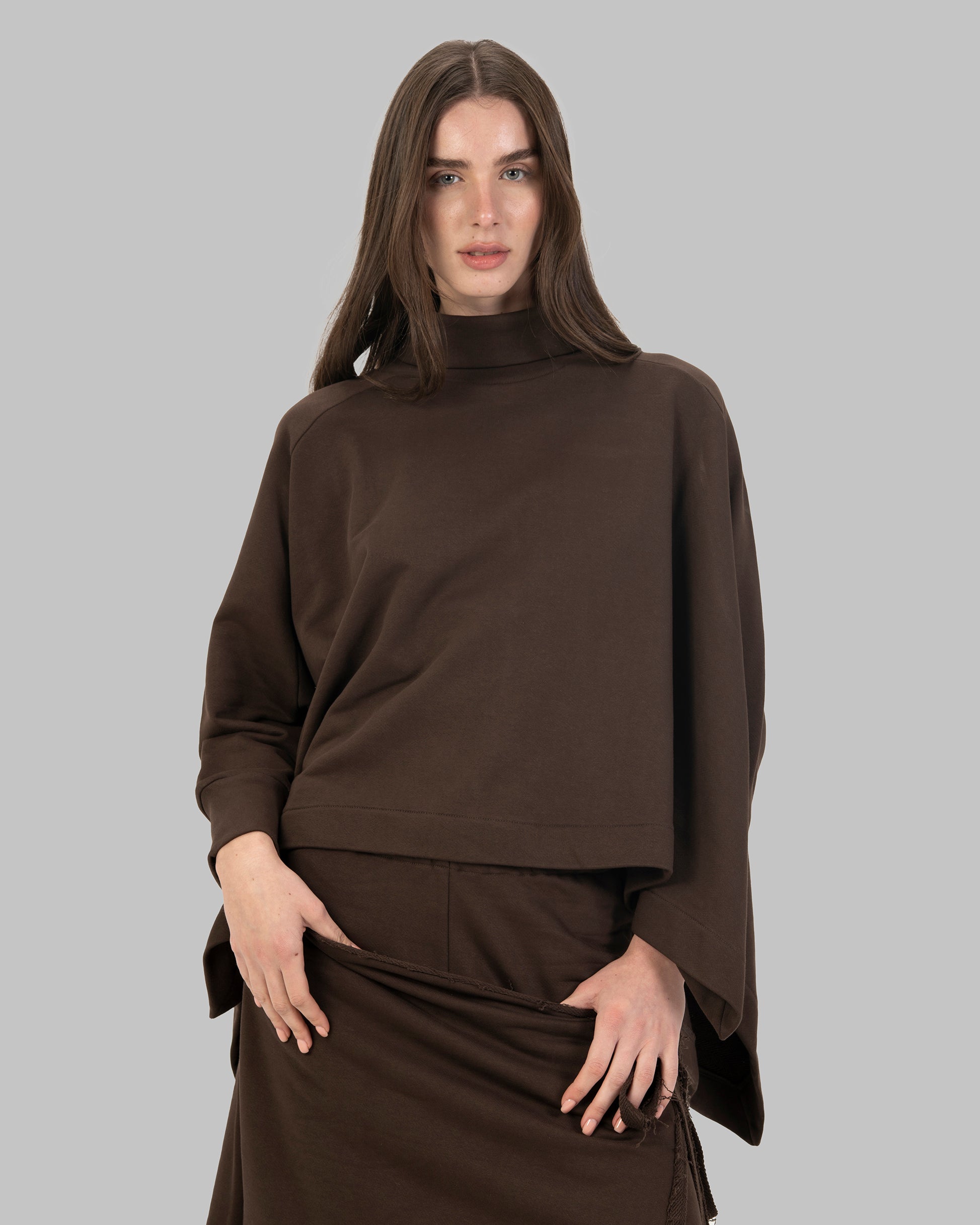 Loose-fit poncho-style top made of soft fabric.