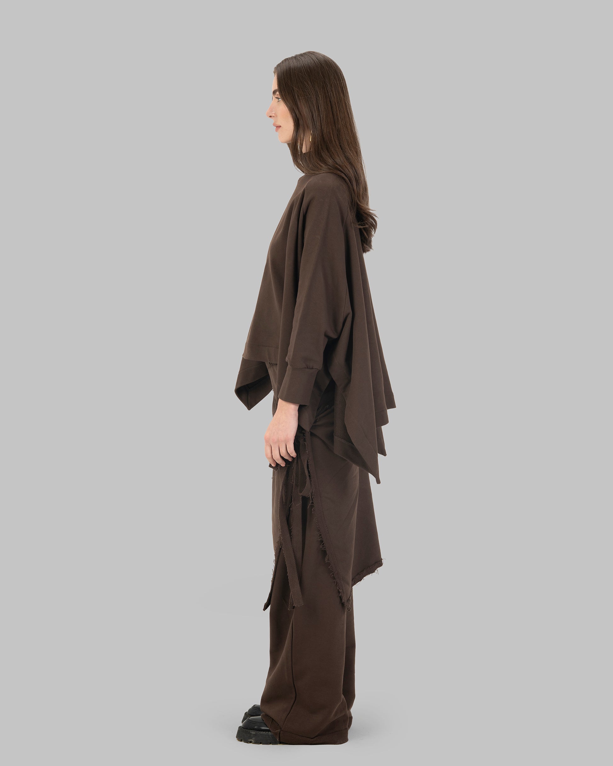 Loose-fit poncho-style top made of soft fabric.