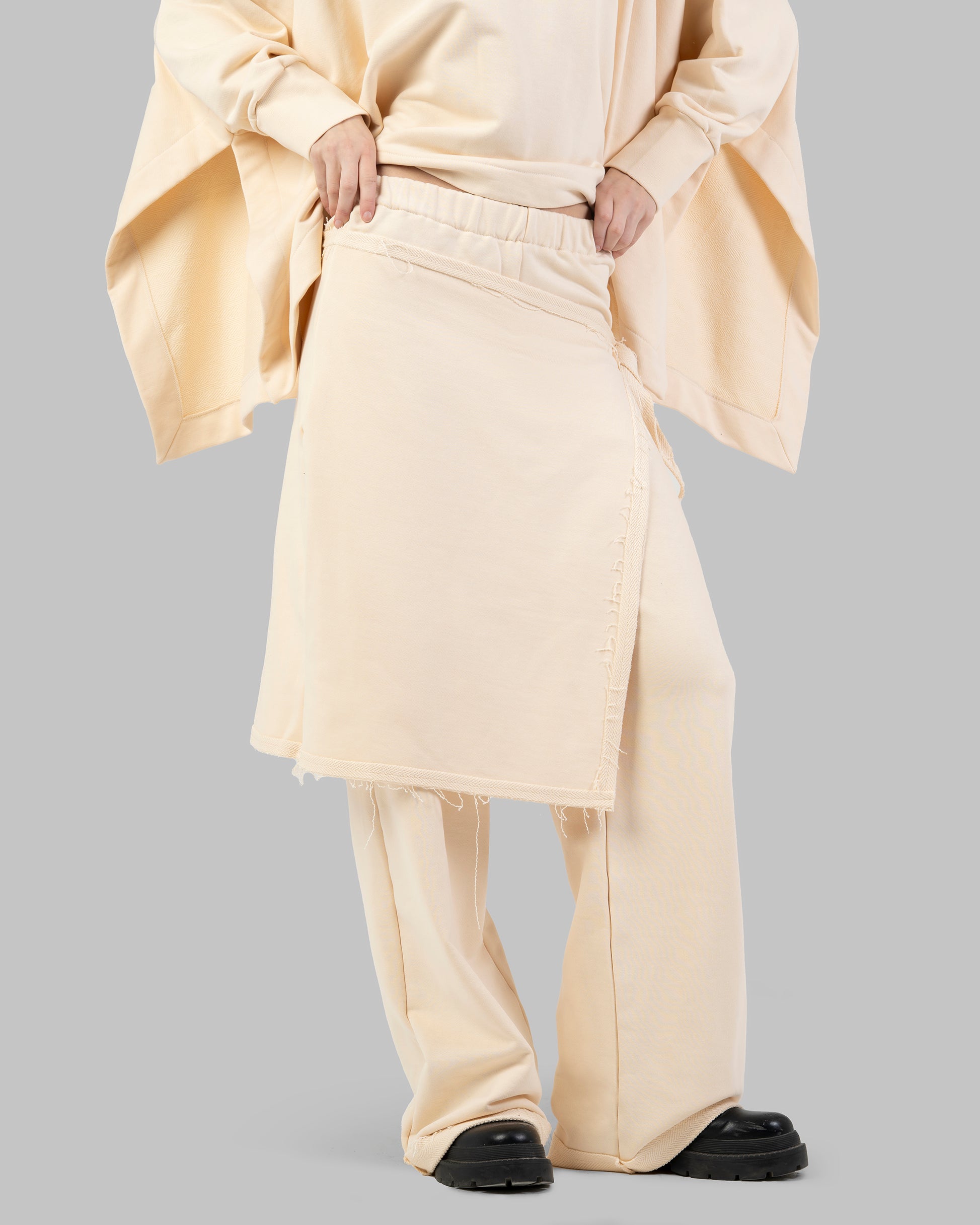 Wide-leg pants with an attached wrap-over skirt panel.