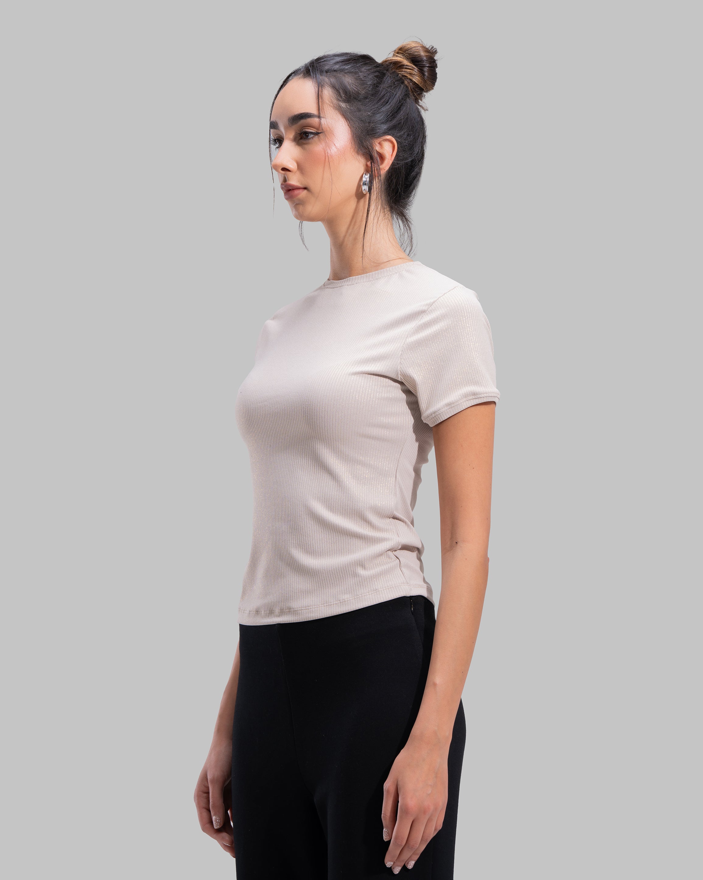 Short sleeve ribbed top with a shimmering metallic finish and round neck.