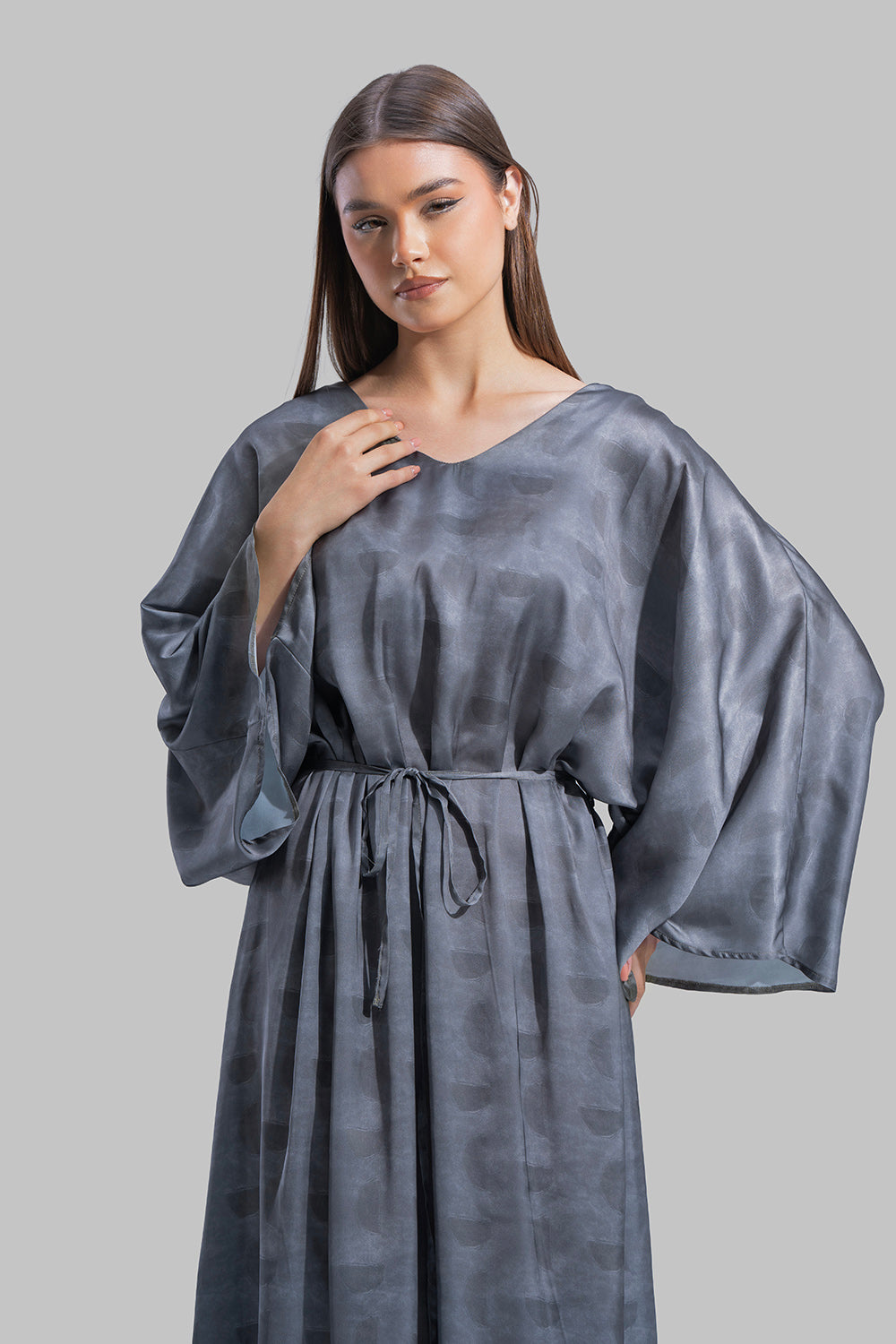 Oversized maxi dress featuring a V-neckline and wide kimono-style sleeves.