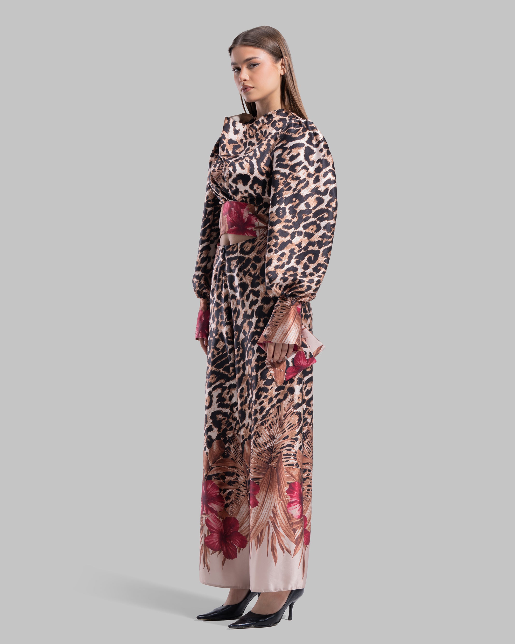 Long sleeve top with a draped neckline and slightly puffed shoulders.