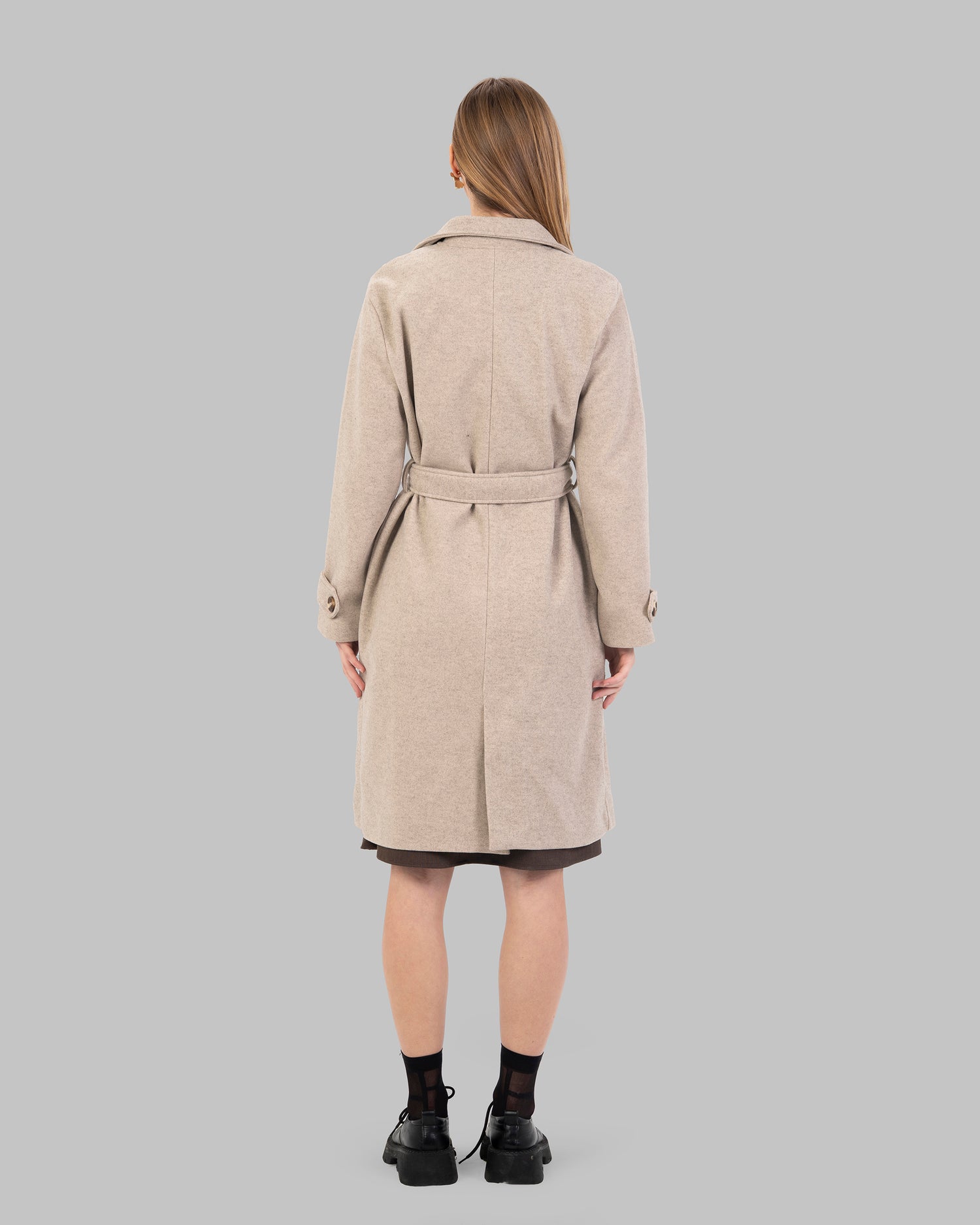 A classic light beige belted coat with a wide collar