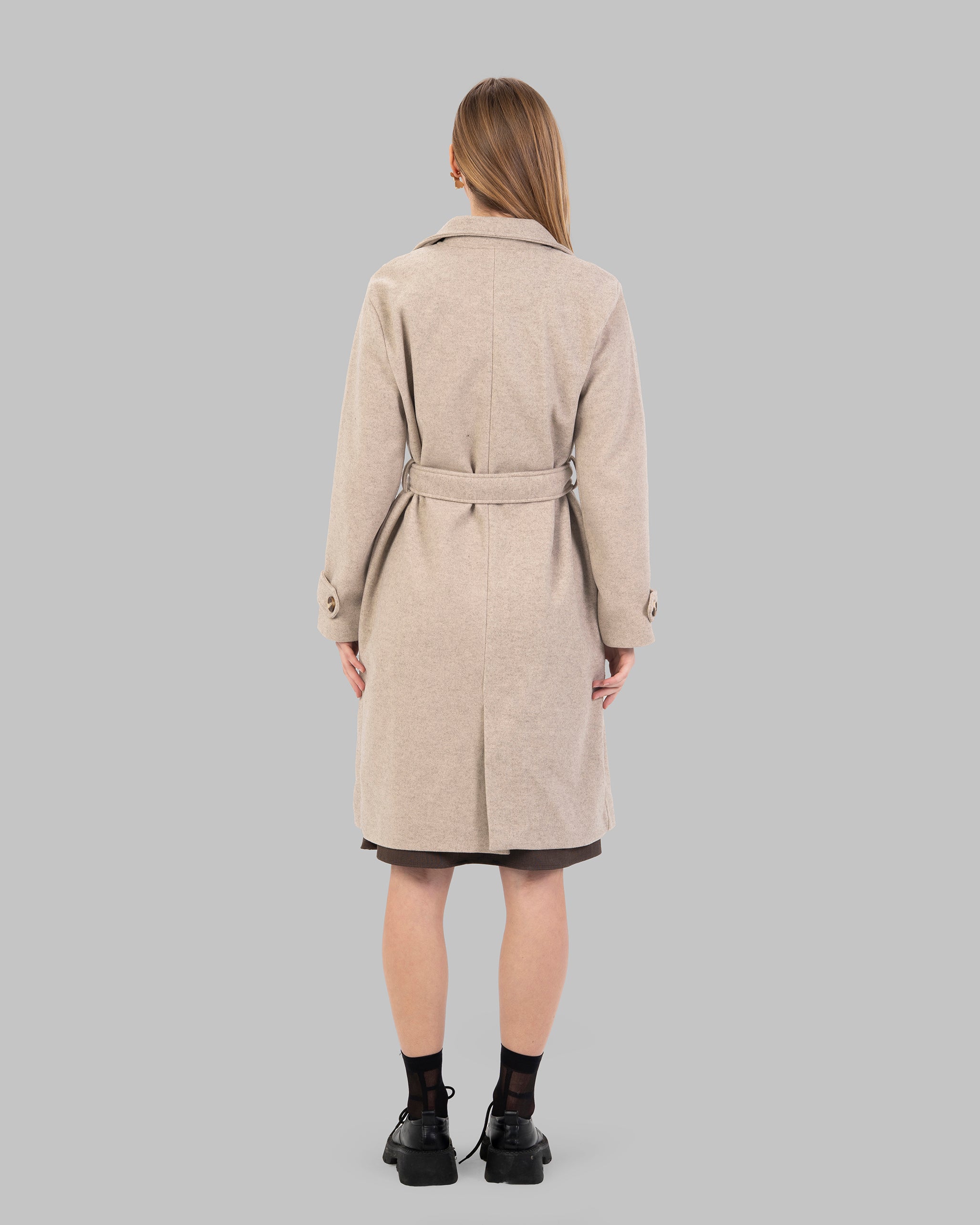 A classic light beige belted coat with a wide collar