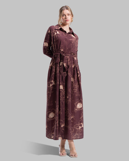 Floral print midi shirt dress with a matching tie belt at the waist.