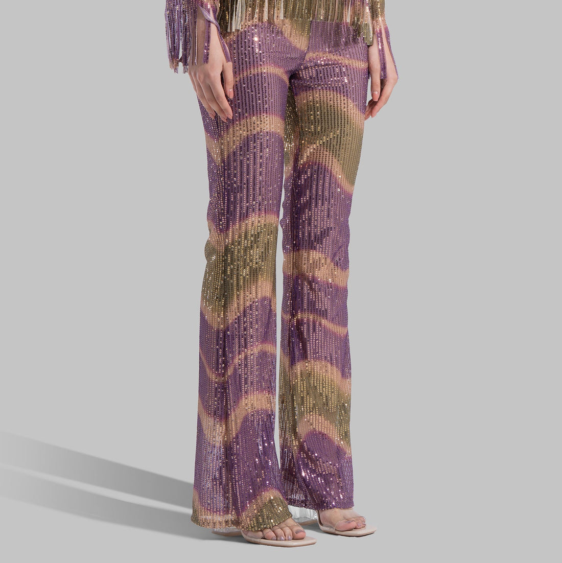 High-waisted Flared Leg trousers with an elastic waistband.