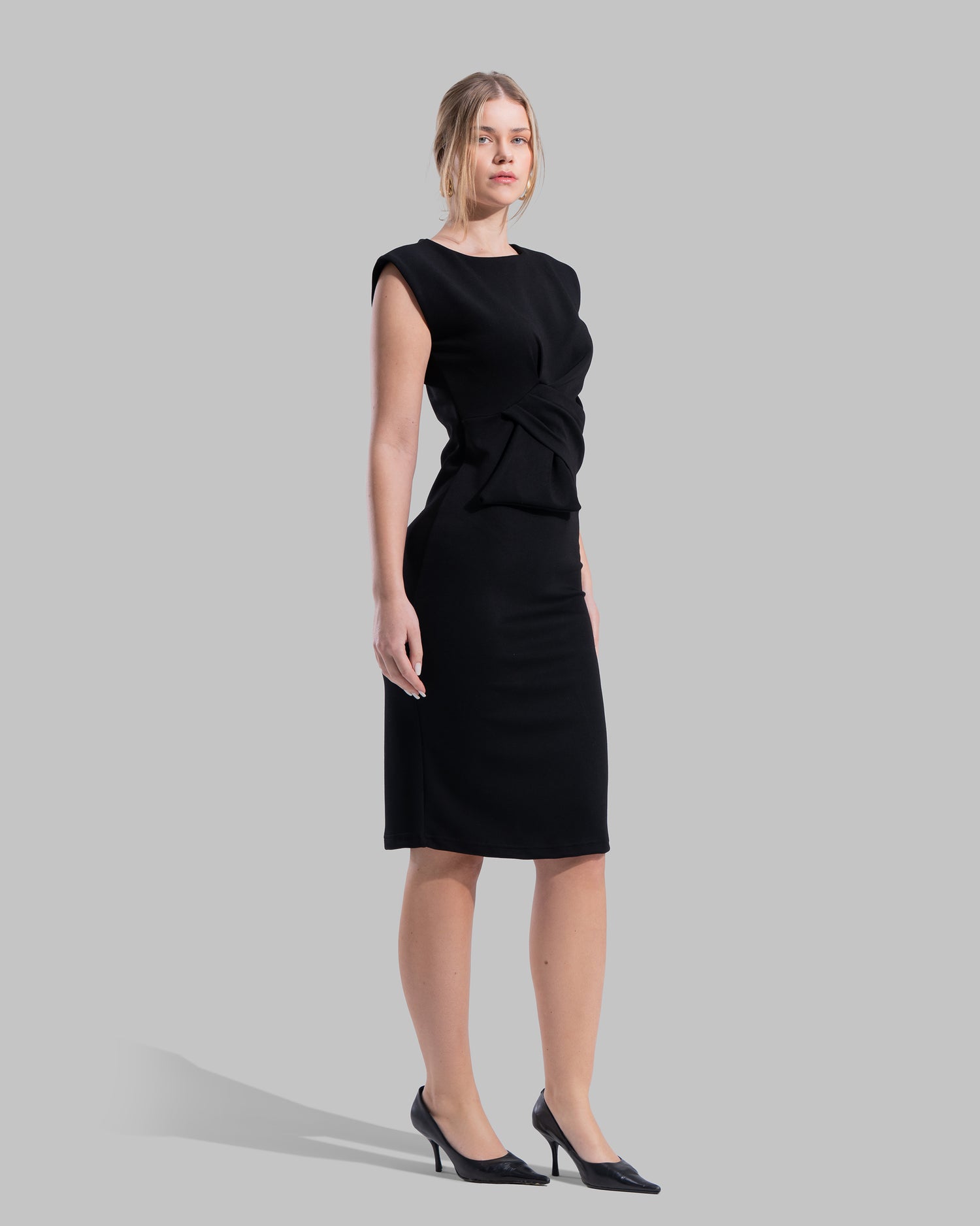 Sleeveless midi dress featuring a round neckline and front draped knot detail.