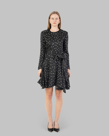 A chic polka dot mini dress with long sleeves and a stylish wrap-around tie waist