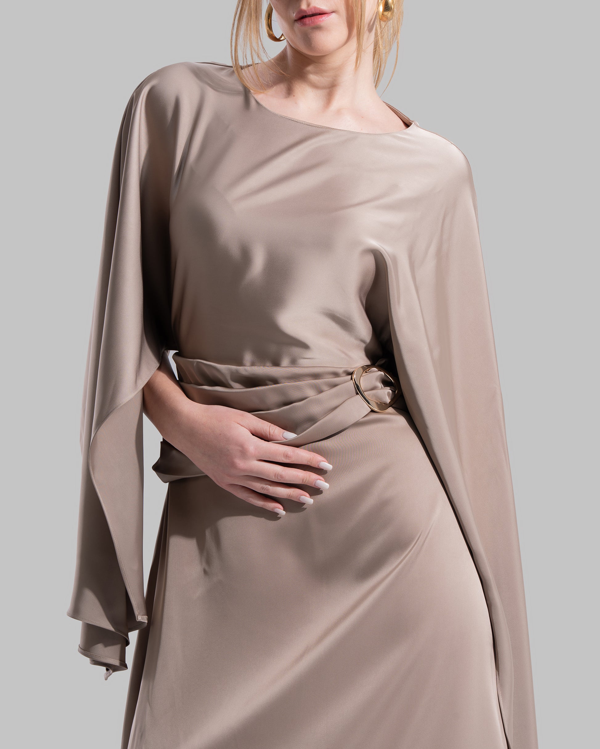 An elegant satin gown of sweeping length
