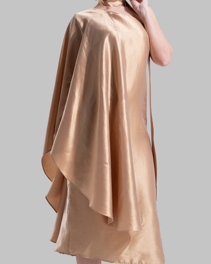 One-shoulder satin midi dress featuring a draped cape overlay and side slit