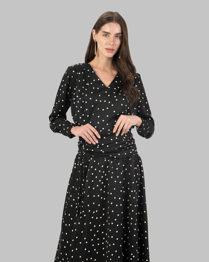 A flowy high-waisted midi skirt polka dots