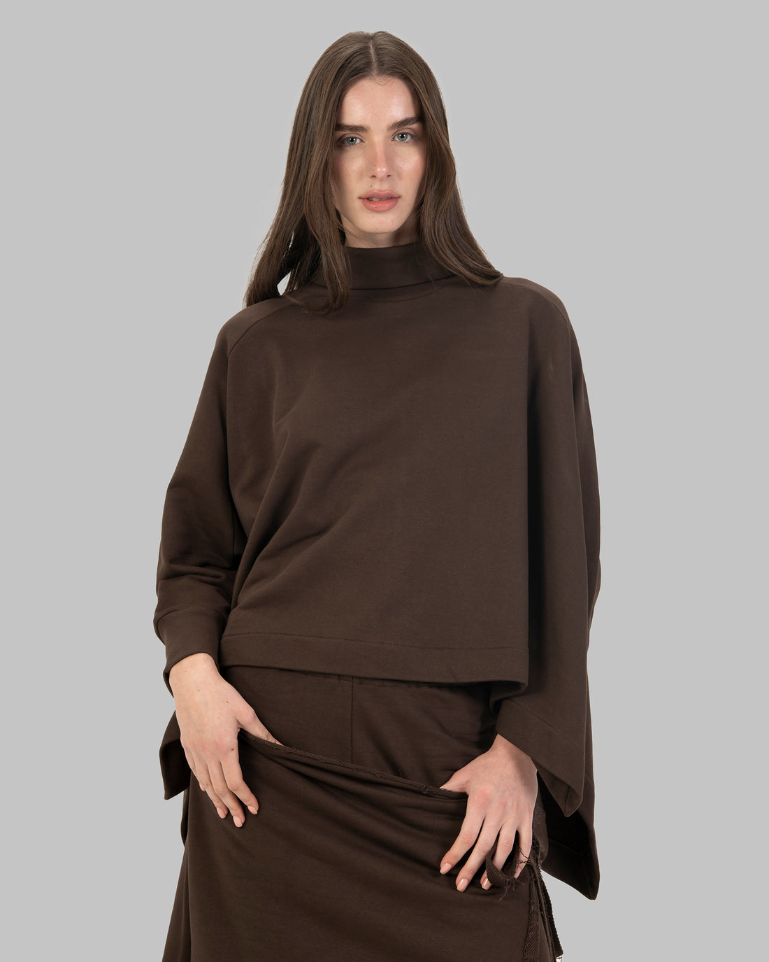 Loose-fit poncho-style top made of soft fabric.