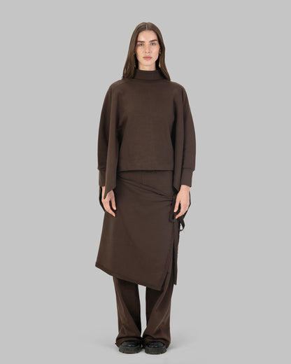 Wide-leg pants with an attached wrap-over skirt panel.