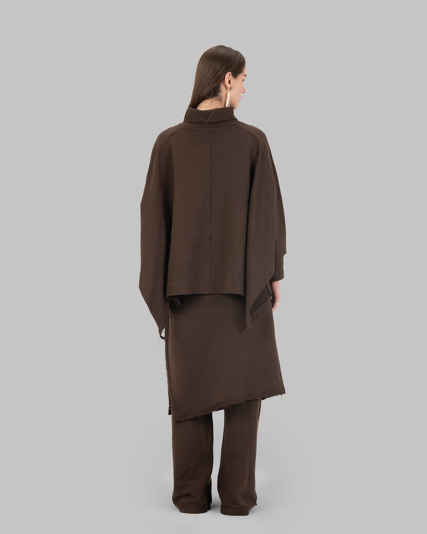 Loose-fit poncho-style top made of soft fabric.