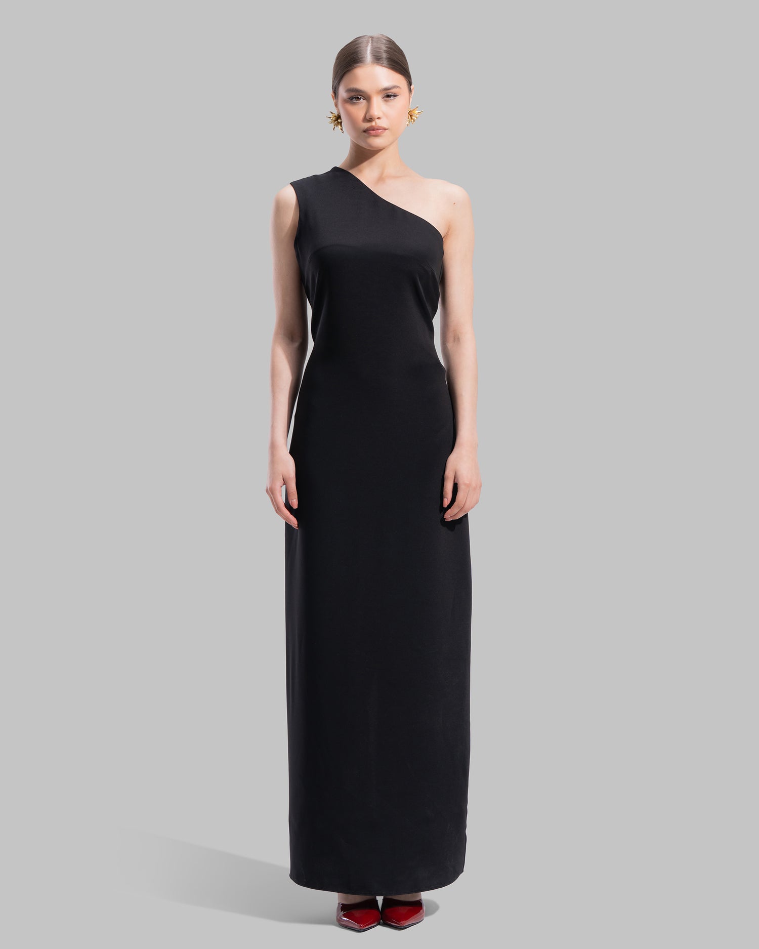 Draped asymmetrical neckline satin maxi dress with a fluid oversized silhouette.