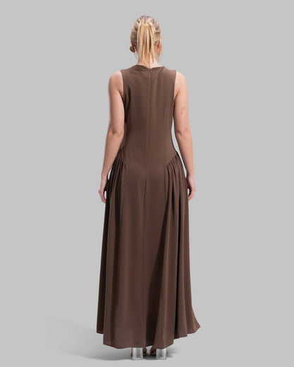 Sleeveless long dress with a round neckline.