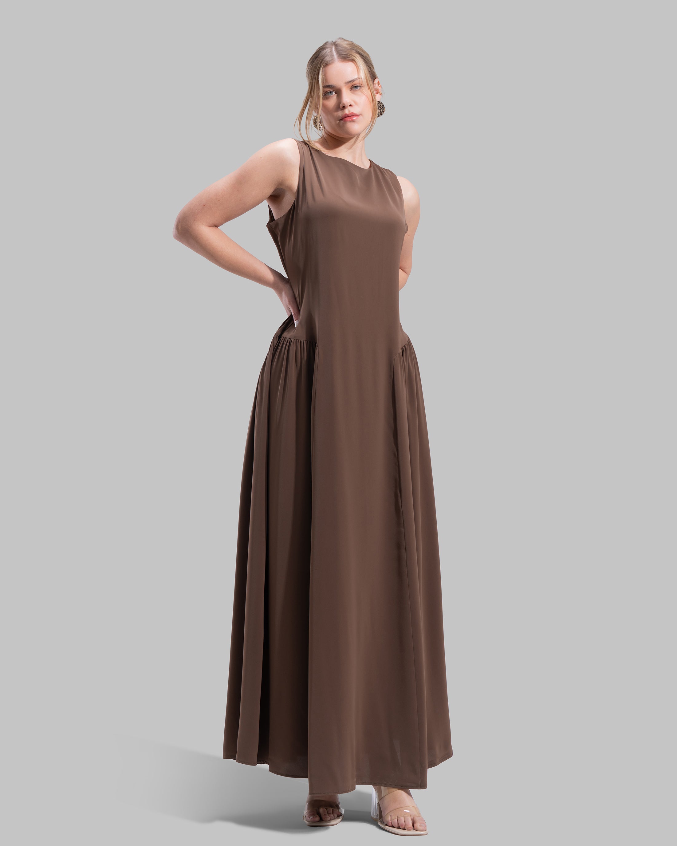 Sleeveless long dress with a round neckline.