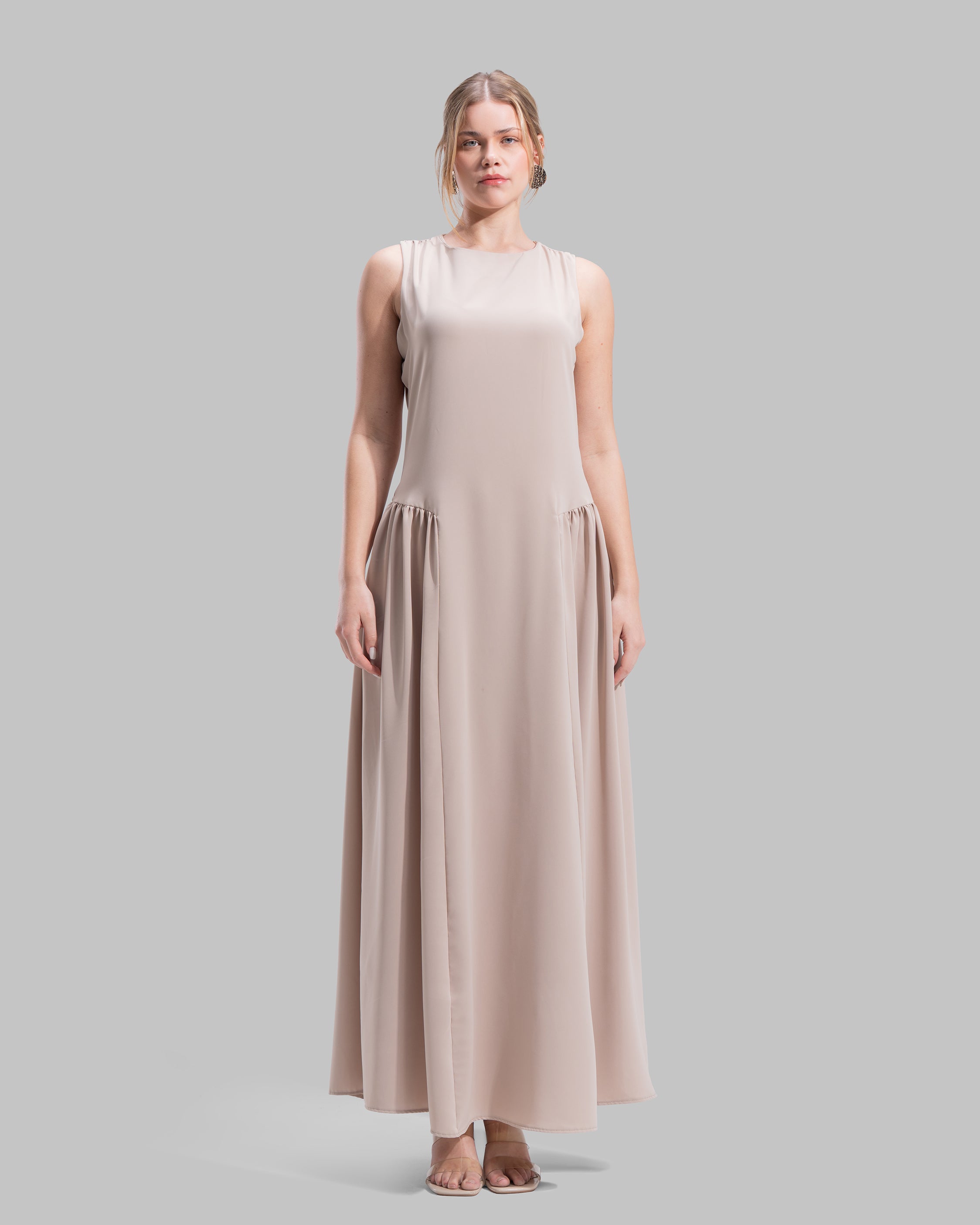 Sleeveless long dress with a round neckline.