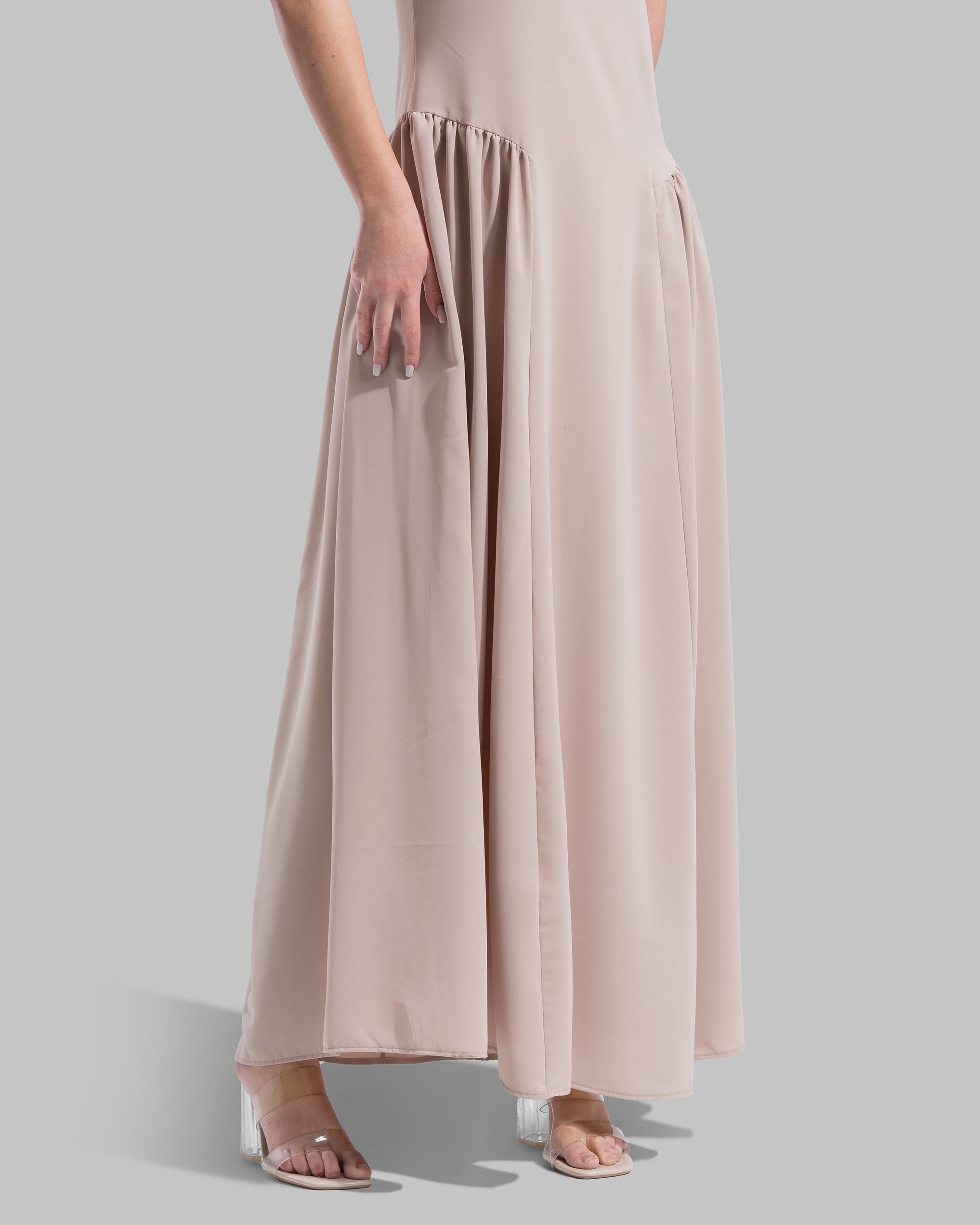 Sleeveless long dress with a round neckline.