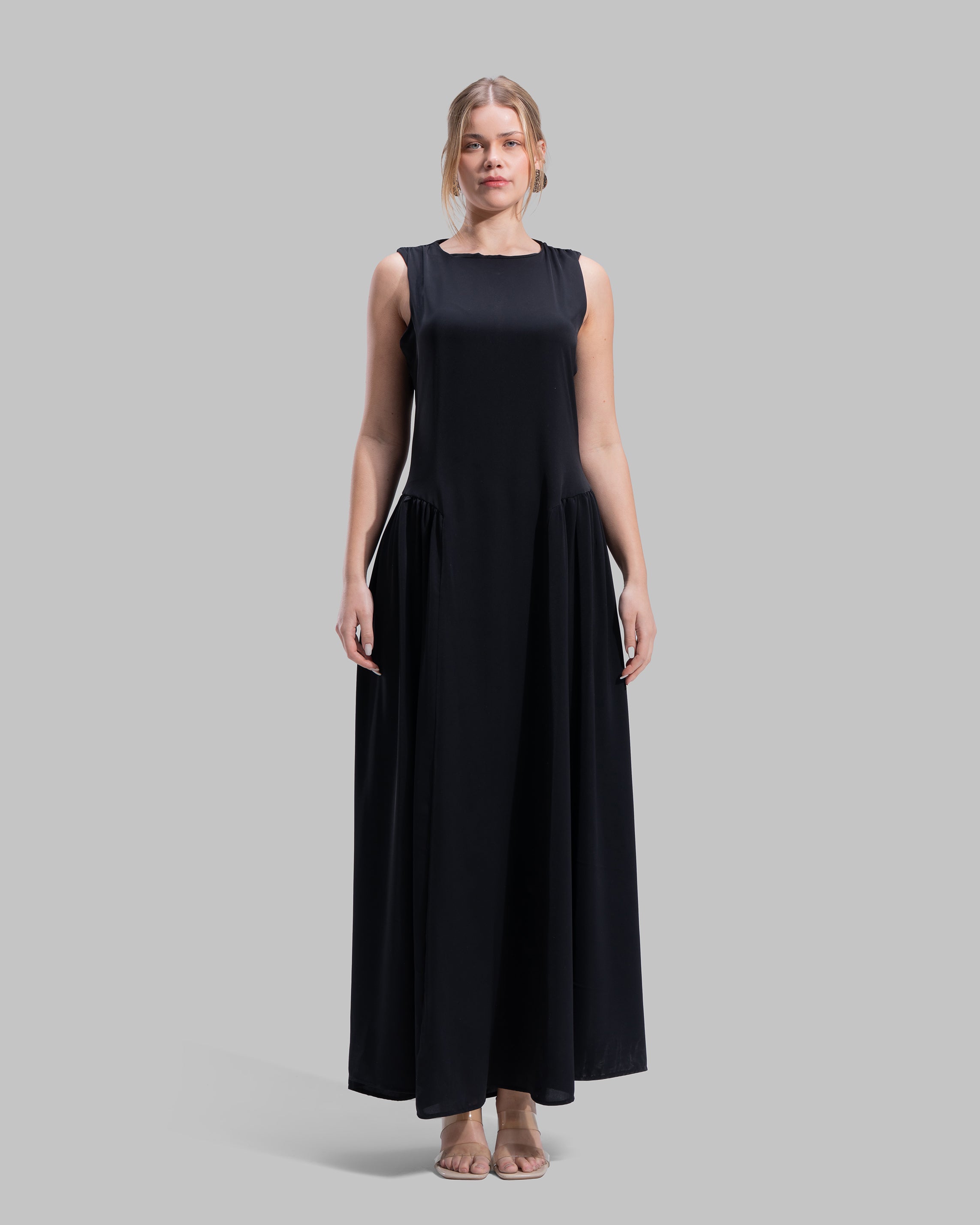 Sleeveless long dress with a round neckline.