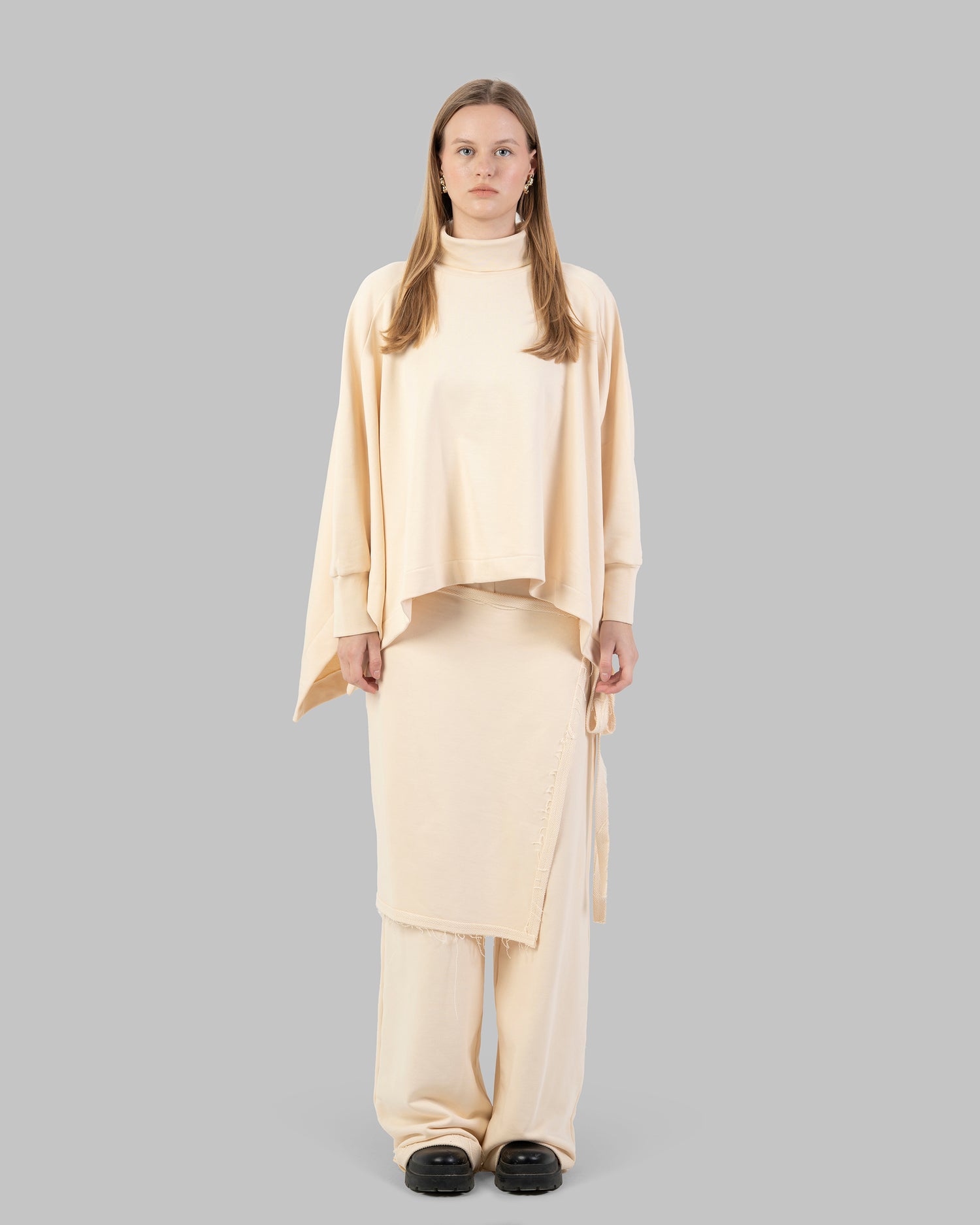 Wide-leg pants with an attached wrap-over skirt panel.