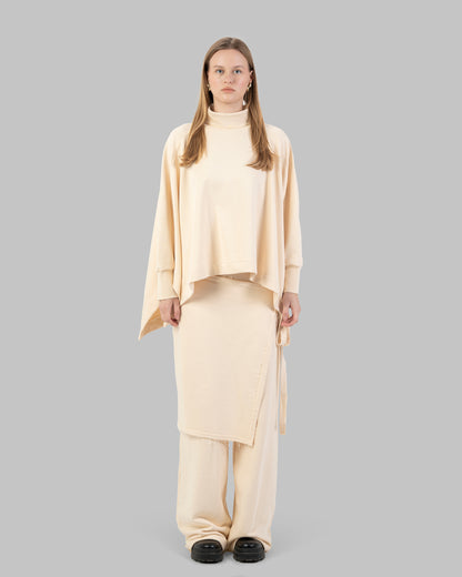 Wide-leg pants with an attached wrap-over skirt panel.