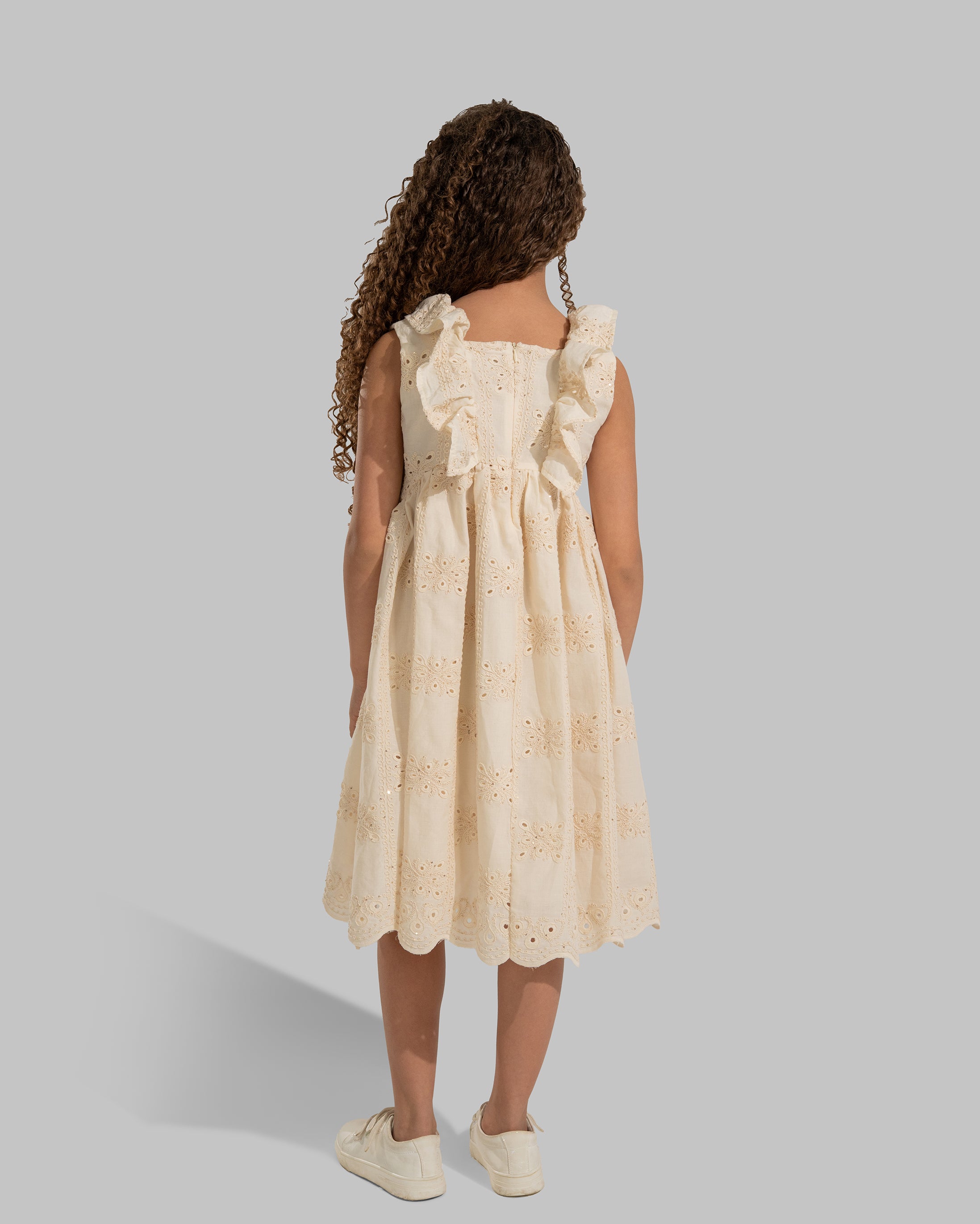 Embroidered sleeveless dress with a square neckline and ruffle details on the straps