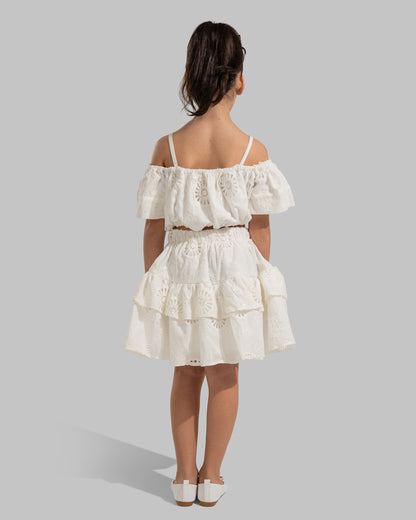 Layered white eyelet mini skirt with a ruffled hem.