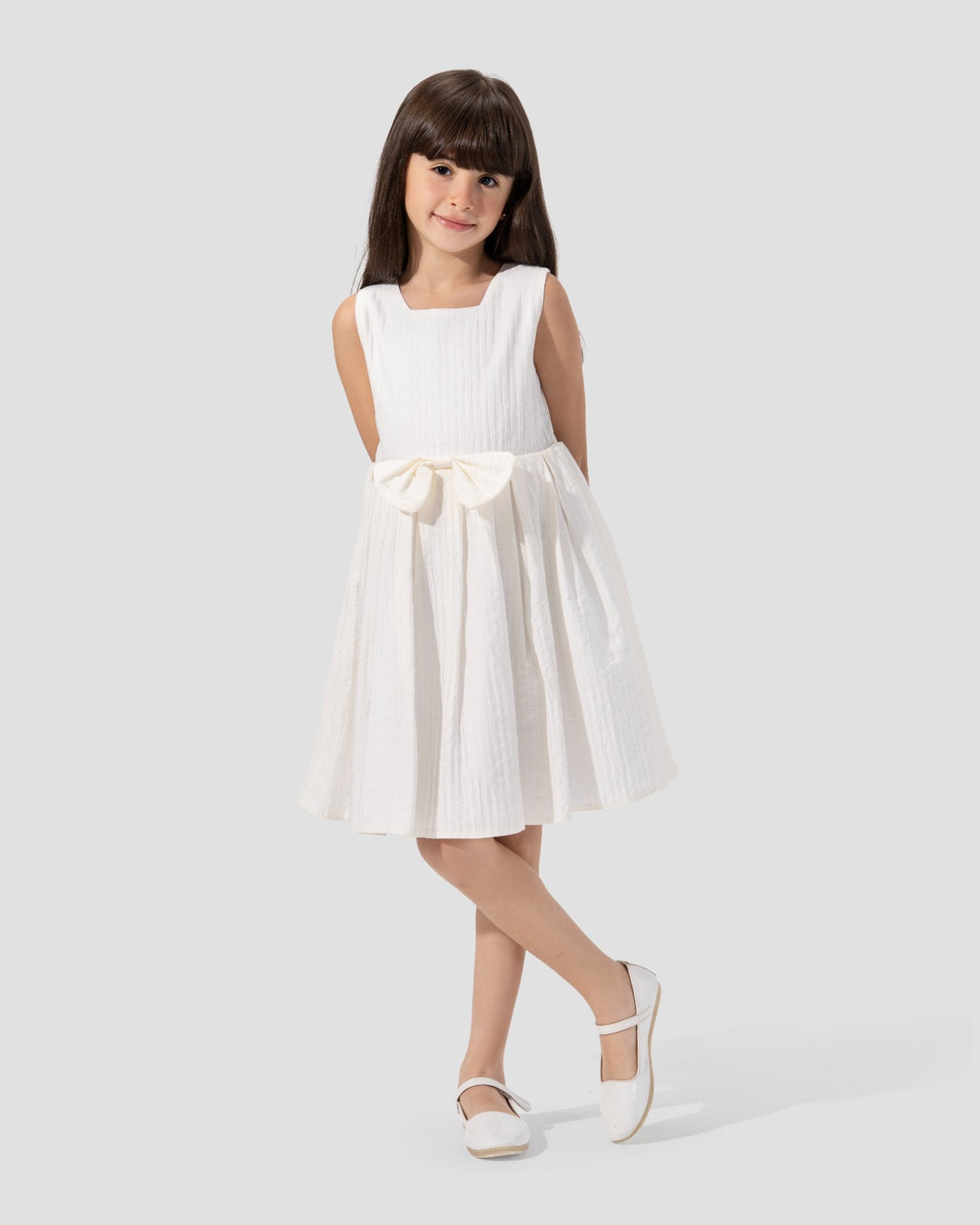 Textured sleeveless dress with a round neckline and a flared skirt