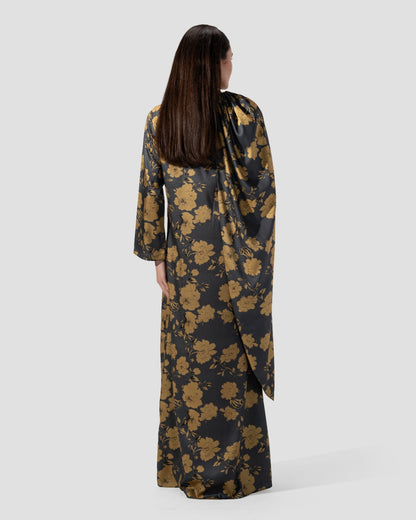loose dress with a floral print of golden flowers .