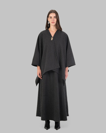 pinstripe poncho with a V-neck and an asymmetric hem.